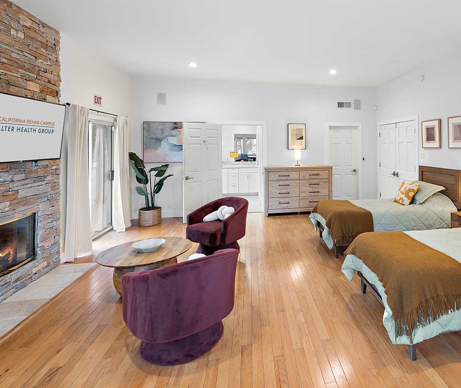 double bedroom with nice chairs and wooden floor at dana point mental health facility