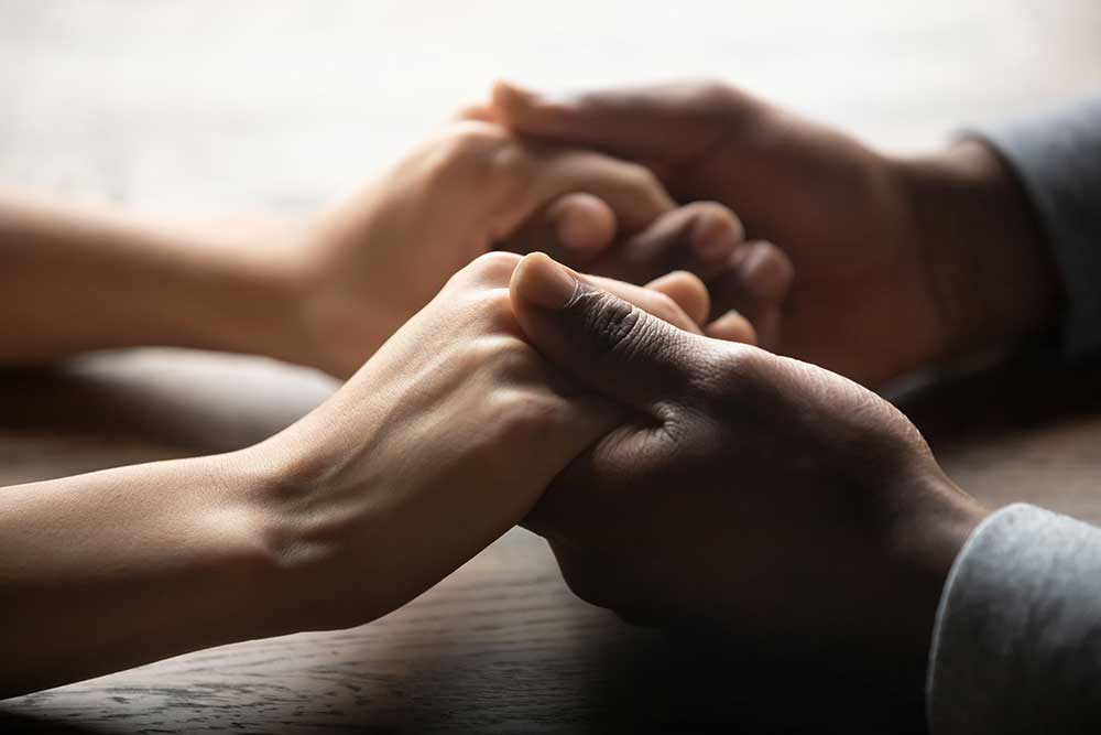 family holding hands with client