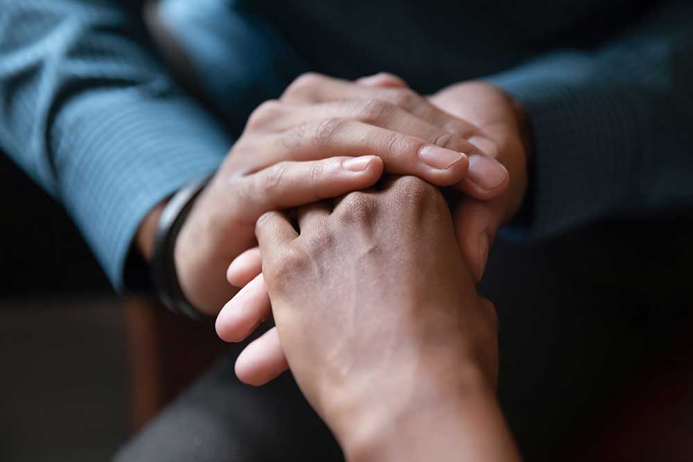 family involvement holding hands