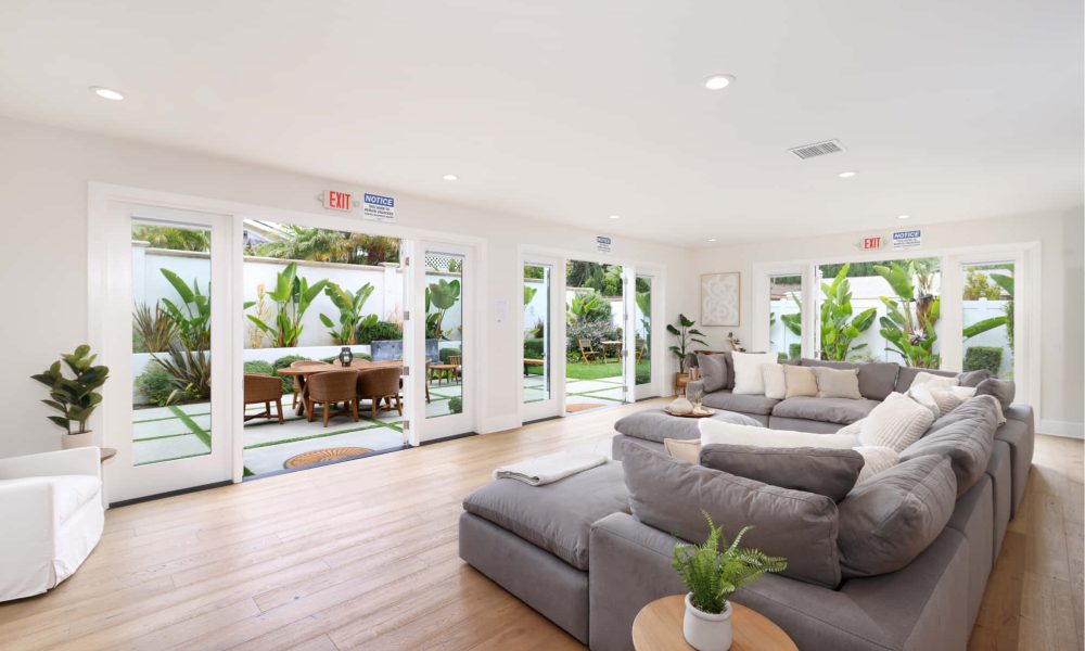 wood floor living room with couches at Alter Irvine location